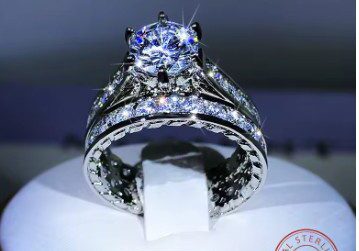 A diamond ring is on display in a box.