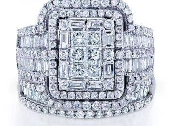 A diamond ring with a large square center surrounded by smaller round and baguette diamonds.