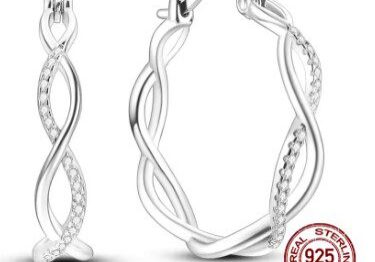 A pair of silver earrings with a diamond design.