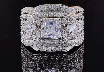 A diamond ring with two rows of diamonds on it.