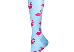 A person wearing blue socks with pink flamingos on them.