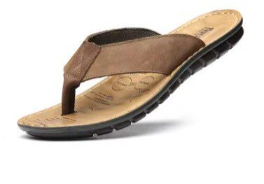 A pair of brown sandals on top of a white background.