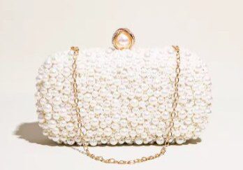 A white purse with flowers on it