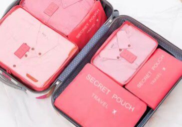 A pink suitcase with two different compartments