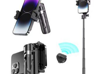 A phone is on the stand and some other items are in front of it