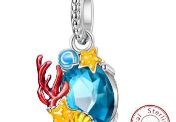 A blue charm with sea animals and coral.