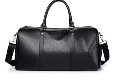 A black duffel bag with a strap around it.