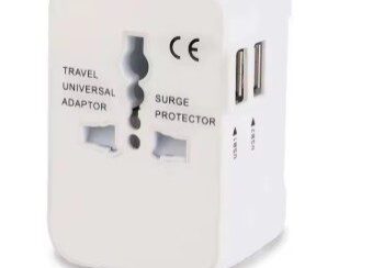 A white travel adapter with two usb ports.
